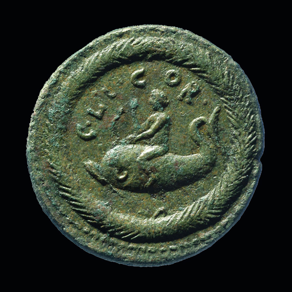 Χάλκινο νόμισμα, Κόρινθος επί Λευκίου Ουήρου, 161-169 μ.Χ. Νομισματική Συλλογή ΚΙΚΠΕ. Ο Παλαίμων-Μελικέρτης πάνω σε δελφίνι.